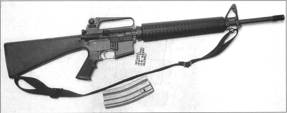16-ar The latest in the M16 family, the M16A2. The standard by which all assault rifles are judged. Note major changes: fully adjustable rear sight, round handguards, longer stock, finger swell on pistol grip and cartridge case deflector. Note the 25-meter zeroing target.