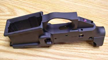 The flared mag well is obvious here. Also note the helicoil in the pistol grip screw hole and the tension screw hole just aft of that. These are all cool, useful features not commonly found on a standard forged lower.
