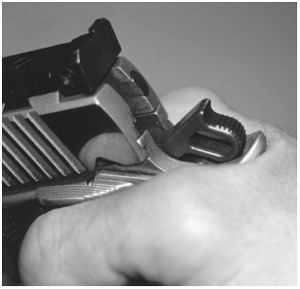 A high-hand grasp on a Kimber Gold Match .45; note the “ripple of flesh” at the web of the hand.
