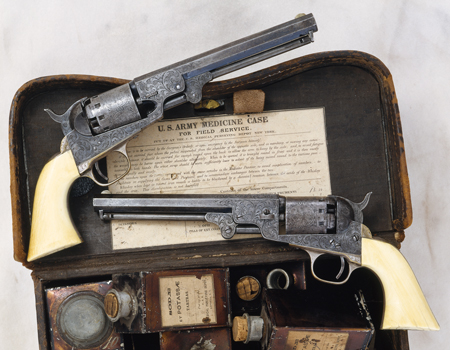 Matched pair of presentation, engraved, ivory-grip MANHATTAN 36-caliber percussion, 5 shot-revolvers with 6 1/2-inch barrels. Each handsomely inscribed along their backstraps: “to G. W. France Acting Assistant Surgeon, U.S.A. / from Attendants of U.S. Gen. Hospital No. 11.” Illustrated here with a Civil War Army issue Hospital Steward’s (Corpsman) medicine case as worn on a waist belt. Dr. France served as a surgeon at a Prisoner-of-War camp outside Nashville during the Civil War; following cessation of hostilities he continued duty 1865 to June, 1866 at Army posts in Oregon Territory.