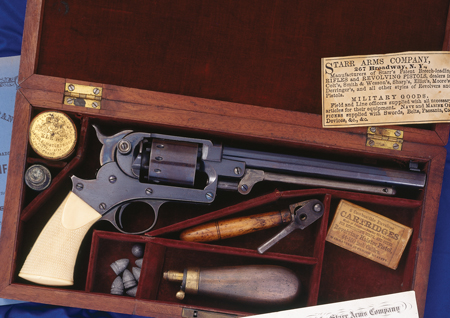 Large Civil War-era Starr Arms Company, New York, single-action Model 1863 percussion 44-caliber revolver; an example of very earliest production with extremely low serial #15; entirely unmarked and with a distinct civilian-type blued finish (versus the less brilliant, somewhat duller, most often encountered military blued finish). Checkered one-piece ivory grips. Cased in original factory walnut box with red velvet compartment type lining, and original accessories and literature. Note: The great bulk of production of Starr revolvers was acquired by U.S. Army for military issuance during the Civil War.