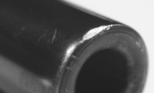 BuyingUsed-30002 When buying a used firearm, look for signs of dropping. This dented barrel may not have harmed the crown, but it might have lead to the barrel being bent or the frame twisted. Look, check, and get a return guarantee if you can.