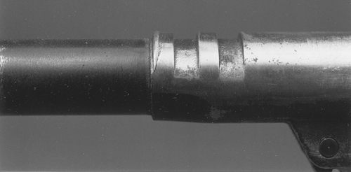 BuyingUsed-gpr4-4 This is a soft, cheap barrel that was improperly fitted. The slide peened the barrel until the upset metal bound against the inside of the slide enough to crack the barrel on the bottom. Buy good parts and fit them properly.
