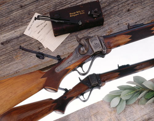 SellingGuns-15 Model 1874 Long Range Target Rifle No. 1 made by Sharps Rifle Company, Hartford, Connecticut with special order ornamentation by the noted arms engraver L. D. Nimschke. Factory shipping records (still in existence) indicate this was a special order rifle that had been tested for perfection by the factory superintendent himself. The rifle was given as a shooting prize to W. L. Ellison of Kansas City, Missouri in February of 1879. Shown here with close-up detail with its long-range Vernier tang rear sight yet intact.