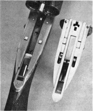 Darne-6 The bright “squares on the receiver are, in effect, the sears of the Darne action. At right is the actual receiver turned upside down.