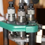 Setting up new reloading dies, Workman raises his shell plate and then screws down all three dies to gently touch the plate.