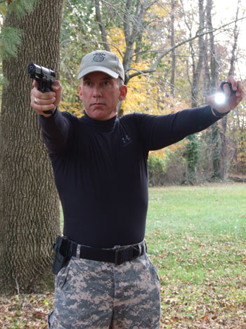 one-handed FBI-style shooting position