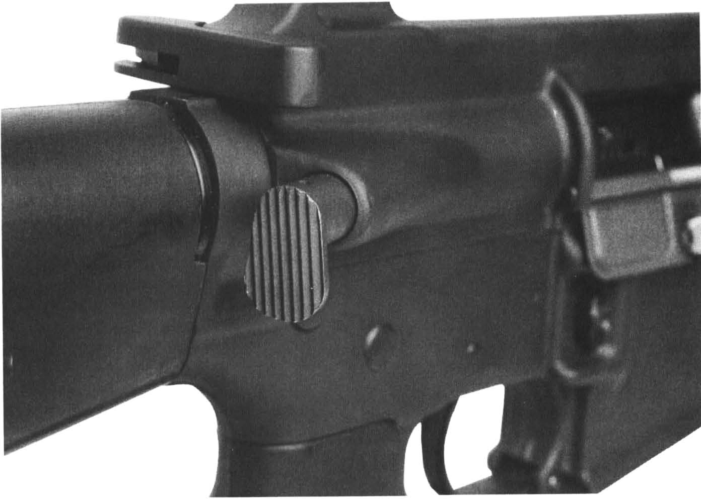 5-ar The forward assist bolt closure mechanism. The M16A1 (shown) had the “tear drop” style while the new M16A2 has a round button style.