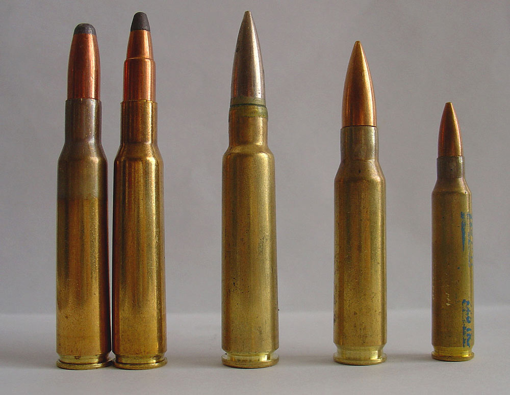 Two 7x57 cartridges (left) next to 7.5x55 Swiss / GP11 (mid), .308 Winchester and .223 Remington (right).