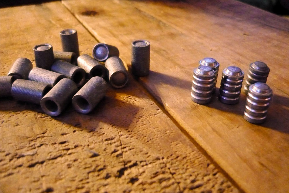 Cast lead bullets can be customized to a shooter needs. Above are examples of hollow base wacutters (left) and solid base wadcutters (right).Photo courtesy Massaro Media Group and JNJphotographics.