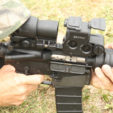 A red-dot sight, like this EOTech, can also be teamed up with a magnifying adapter, and thus get you the best of both worlds.