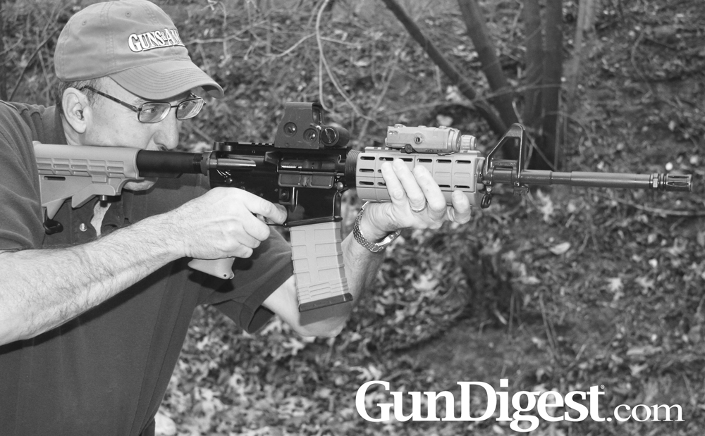 AR15Review-Delton-Lead A reliable rifle, but one thing I’d have to change is the SAW-shape grip. As you can see, the extra length and swell doesn’t do anything for my grip.