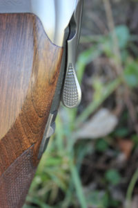 The toplever shape, like the action, has a lower profile. The safety is still located on the tang and it still incorporates a barrel selector.