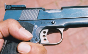 ColtNationalMatch-6 NM suffix is noted on serial number of author’s pet pistol. Signature Gold Cup style trigger was later replaced with this Videcki unit. Note slanted slide grooves, relieved ejection port, both standard on second incarnation of the National Match. This gun has the controversial light slide, not externally detectable.