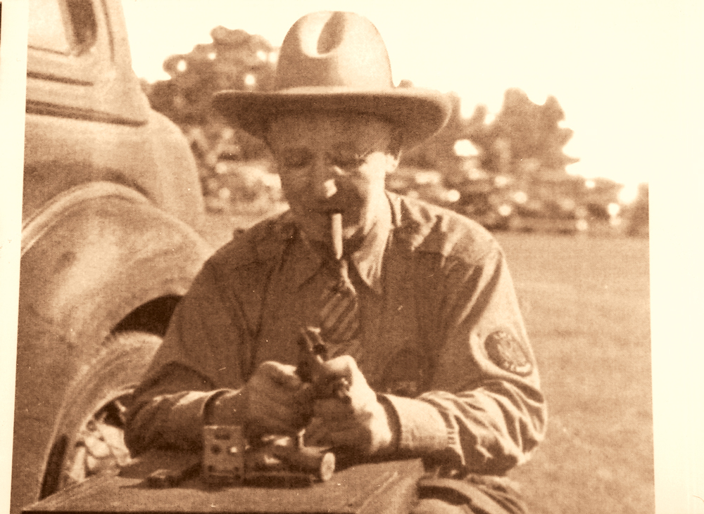 ColtNationalMatch-8 The legendary J.H. Fitzgerald had a lot to do with the National Match. He’s seen here adjusting a 1911 at Camp Perry circa mid-1930s in Tim Mullin’s American Beauty.