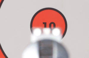 Incorrect sight focus. Note the blurry front and rear sights versus the sharply focused target. This is a common cause of inaccurate shooting.