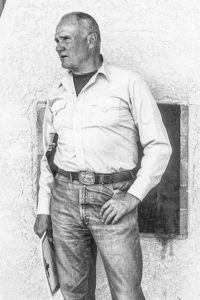 Jeff Cooper passing out graduation certificates at Gunsite Academy, the firearms training center he founded.