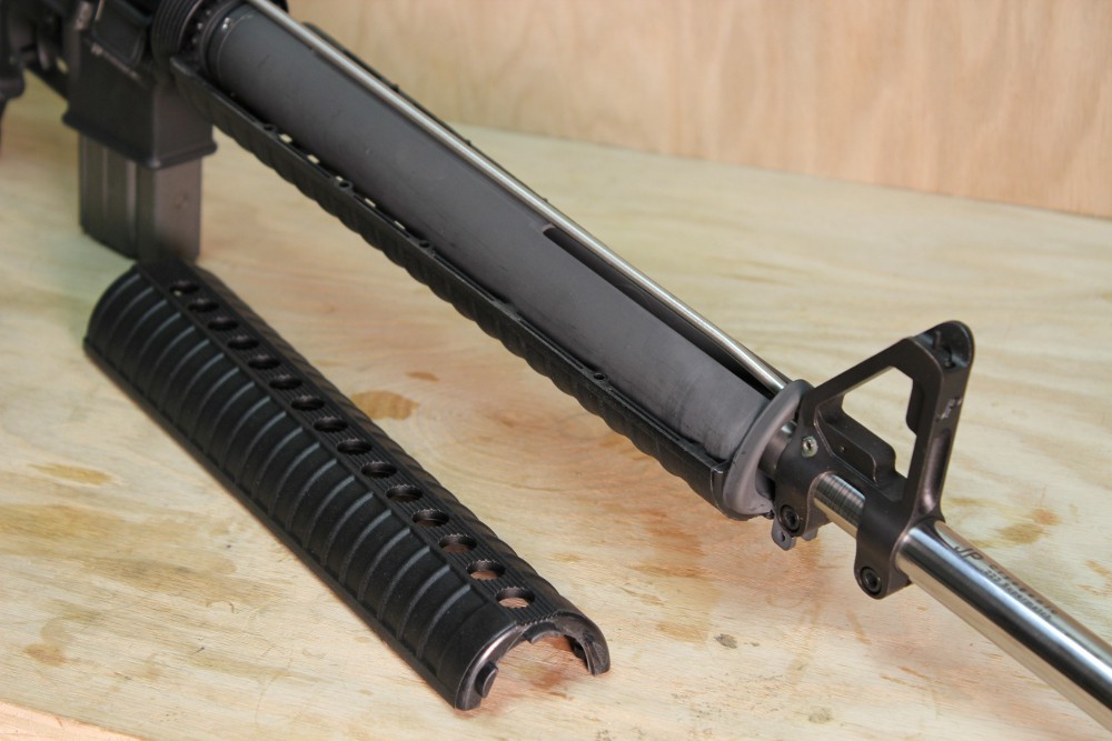 NationalMatchAR-5 While using the same handguard plastic halves, this kind of rifle retains them in a steel tube assembly that just looks like a standard handguard, without touching the barrel, removing stresses, and making the barrel more accurate. Incidentally, the bend in the gas tube is also moved forward to better accommodate the steel tube.