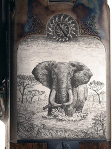 RIASept2011-5 The underside of receiver of the Ken Owen double rifle features one of the most outstanding, and detail rich engraved scenes this writer has ever seen, a large bull elephant walking through the middle of a watering hole.