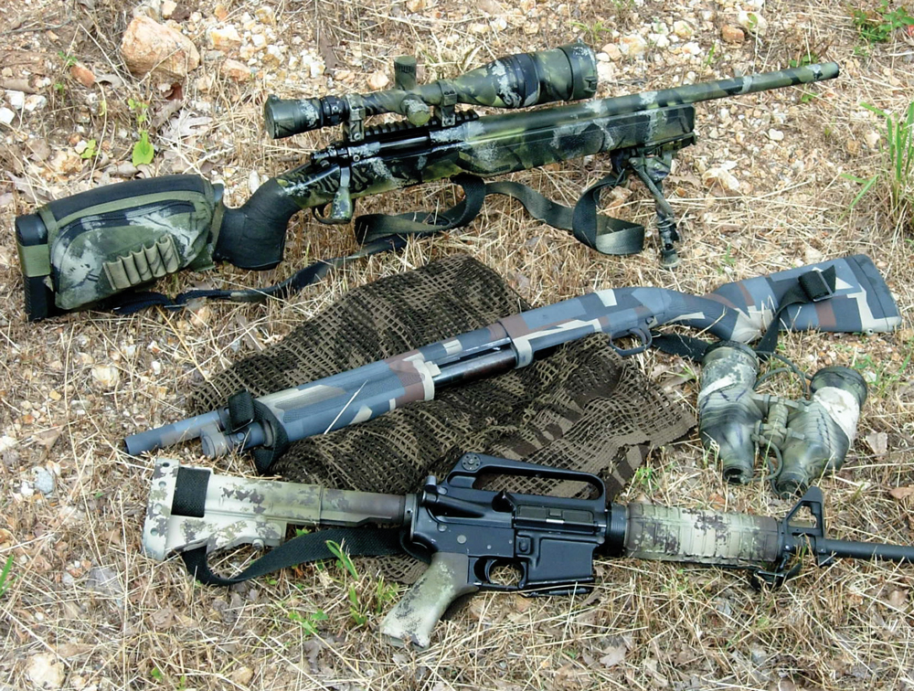 Rifle-Painting-2 The finished products are pictured here. The AR was painted using the sponging technique and the shotgun was camouflaged for urban environments using the masking technique. Several of the different techniques were used on the bolt rifle.