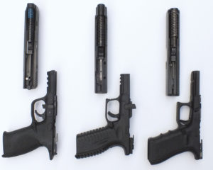 The Glock (right) was surprisingly the hardest to field strip. The Springfield Armory XDm (center) is the only gun in the group that can be disassembled without pulling the trigger. The slide rails on the XDm are impressive compared to the other two guns. Cherie Jones