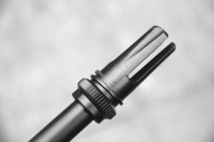 The excellent flash hider and suppressor mount of the AAC Blackout.