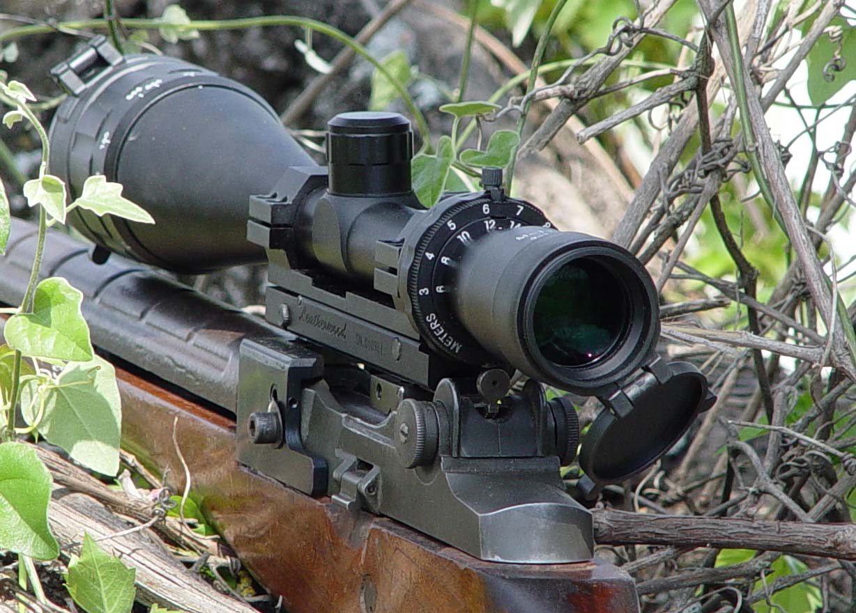 m-1200-bush The Leatherwood ART M-1200 scope autoranges and adjusts for bullet drop for targets from 250 to 1200 yards.