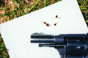 1-1/8-inch five-shot group from 25 yards with Remington Thunderbolt hunting ammo, fired with much-used Sentinal snubby. What looks at first like only four holes is in fact five, with the double more visible when examining exit holes on reverse side of target. Yes, the Sentinal is accurate.