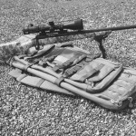 The Savage 110 Tactical .308 Carbine is a five-shot bolt gun that would do for long-range defense, though it is limited in capacity and speed. Factory equipped with an Army Digital Camo stock, the Carbine is shown with a Vortex scope and bipod. The tactical carbine is lighter than many sniper rifles currently available.